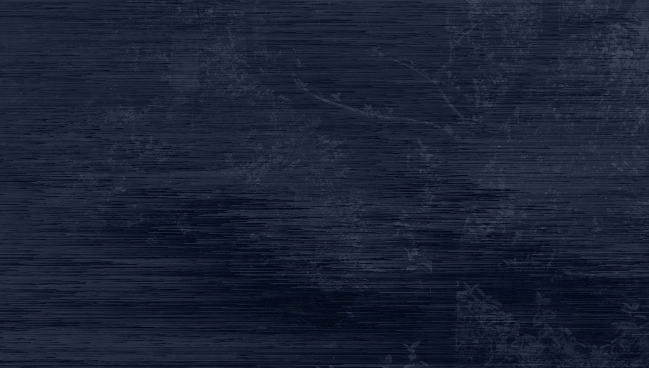 Dark textured background with subtle foliage.