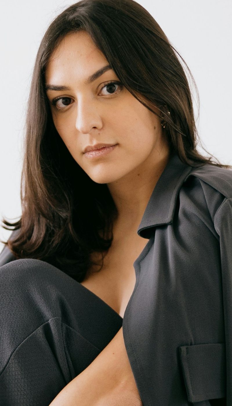 Portrait of woman with long dark hair.