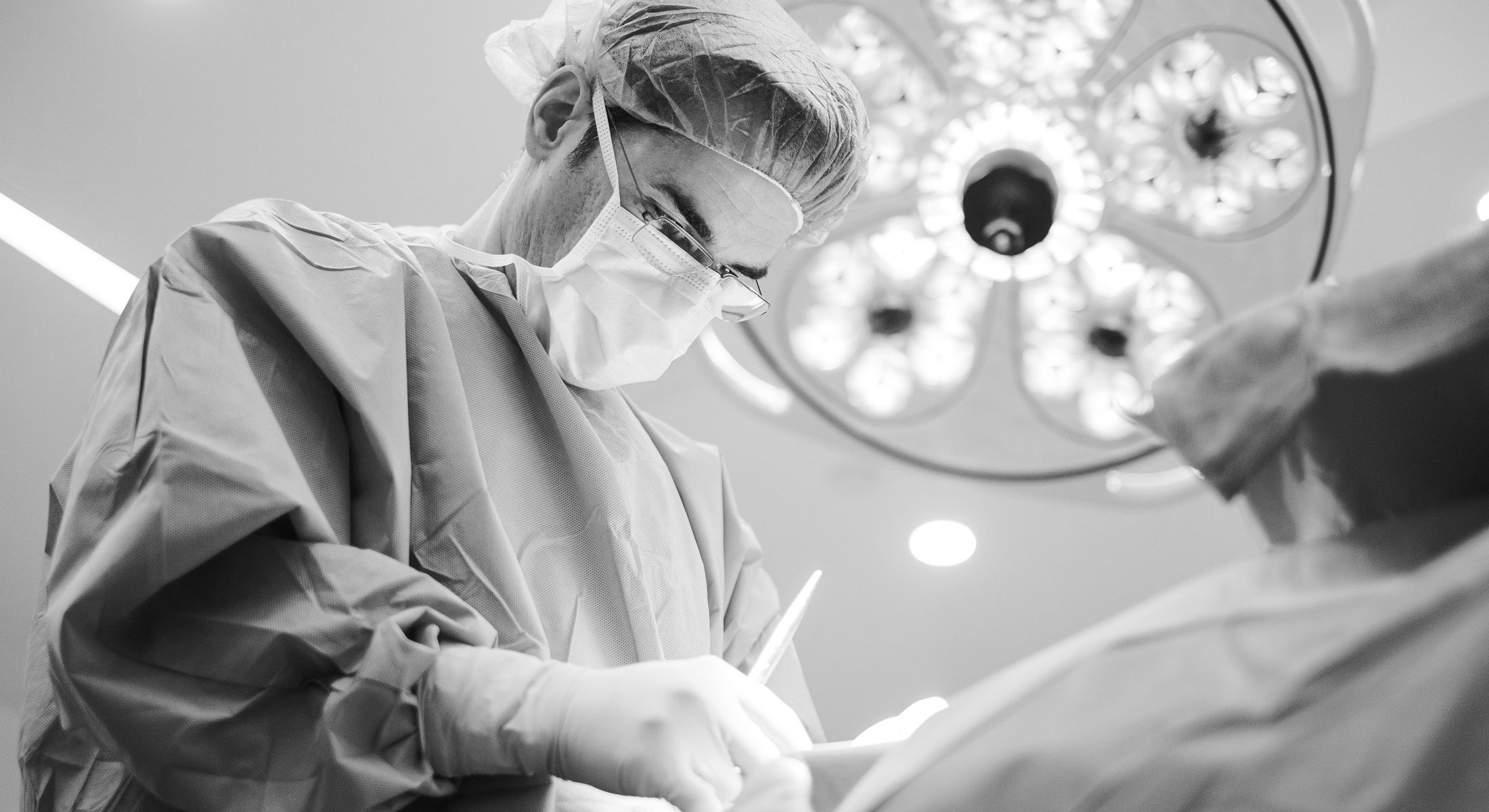 Surgeon performing surgery in an operating room.